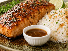 Maple glazed salmon fillet drizzled with sticky maple sauce, served over lime-zest rice garnished with green onions and sesame seeds
