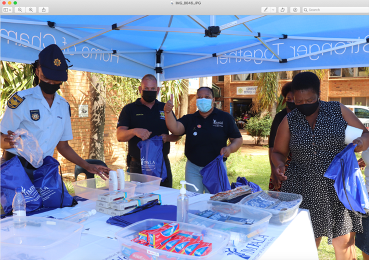 Representatives from Impala Rustenburg and local SAPS packing care packs for the Phokeng Police Station Trauma Centre.