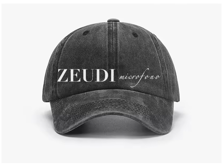 Thumbnail: Black cotton baseball cap with “Zeudi Microfono Hat” embroidered on the front – fan merch inspired by Miss Zeudi Di Palma.