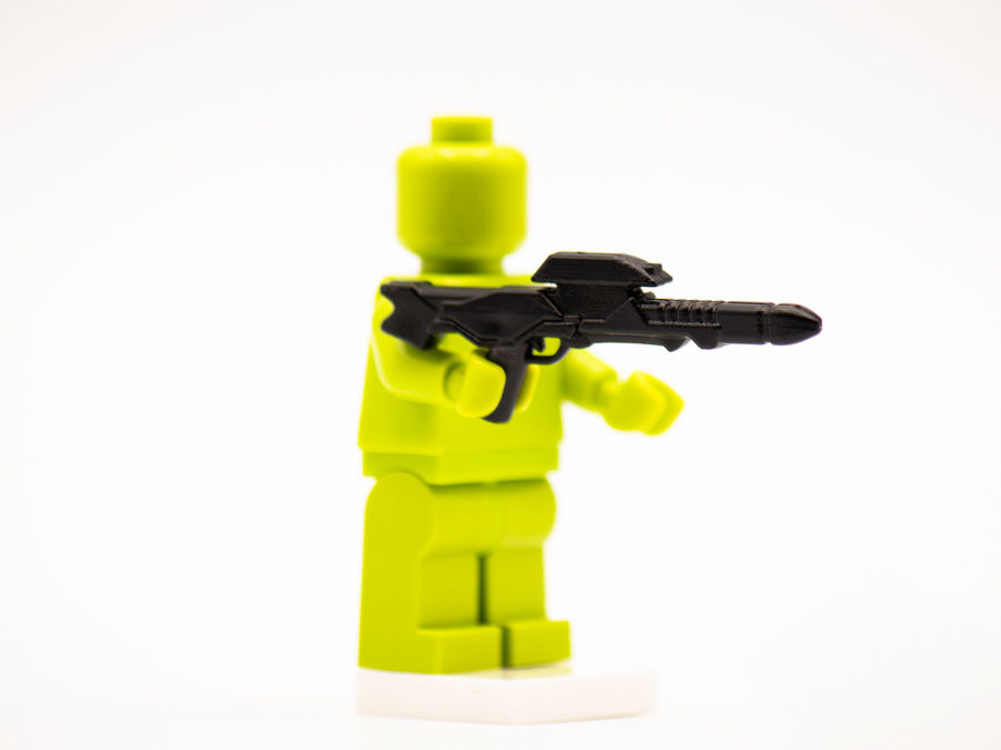 Thumbnail: Lime green minifigure holding a black Mandalorian Ripper blaster