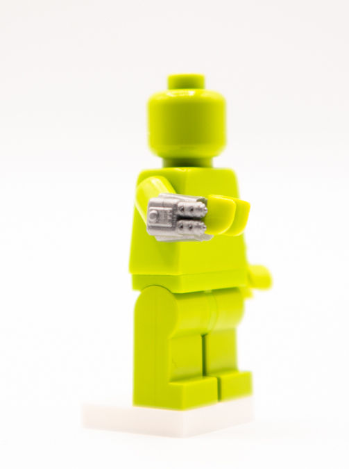 Thumbnail: Lime green droid building brick figure with silver robotic arm