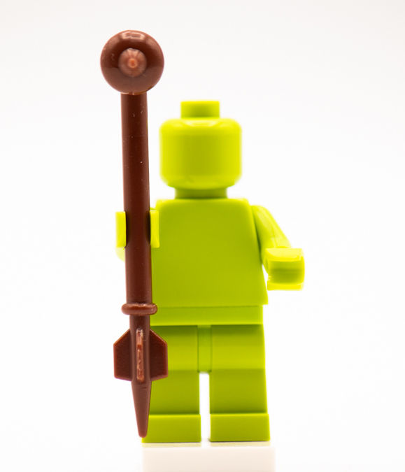 Thumbnail: Lime green brick figure holding a brown Gaffi stick building brick accessory