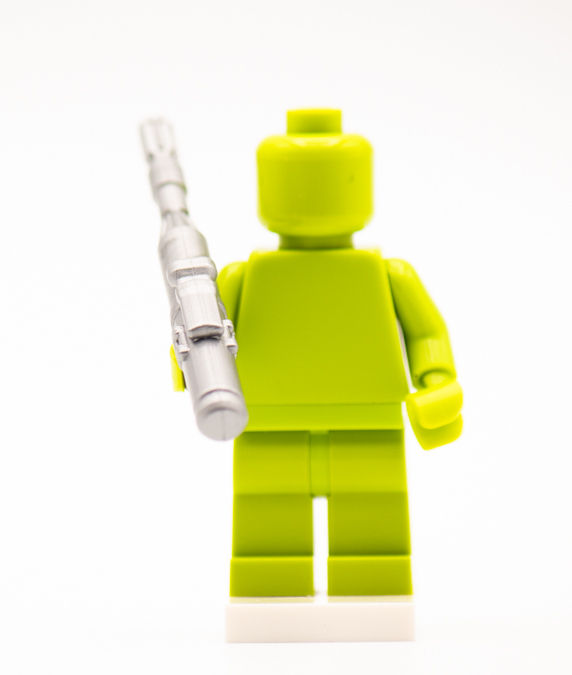 Thumbnail: Green building brick figure holding silver gun