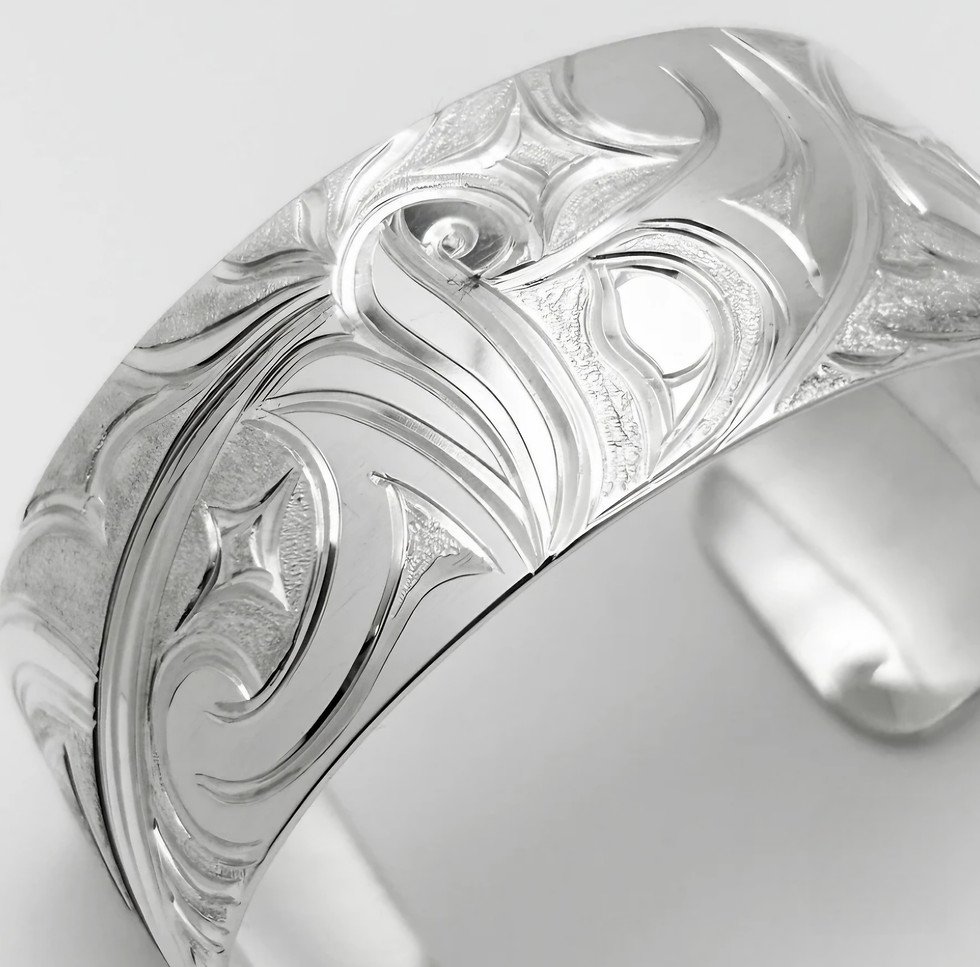 Thumbnail: Intricate silver cuff bracelet with engraved floral design