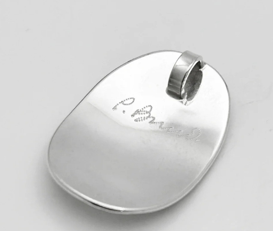 Thumbnail: Silver pendant back, P. Ames signature