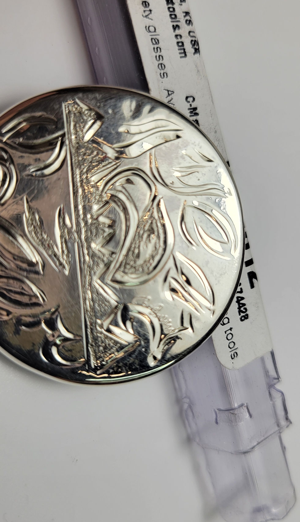 Thumbnail: Silver coin with floral design, showing detail of engraved artwork. One-of-a-kind Coin