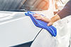 person-cleaning-a-car