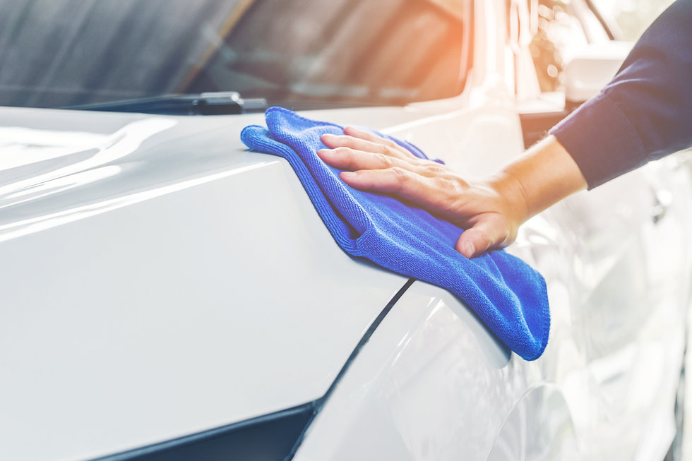 person-cleaning-a-car