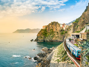 Train running alongside Cinque Terre