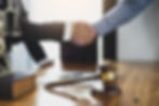 Lawyer shaking hands with their client