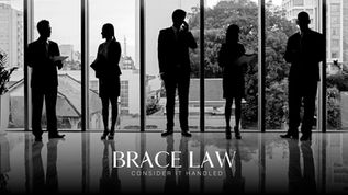 Business professionals standing in an office with a city view, representing skilled workers eligible for Canada’s Significant Benefit Work Permit.