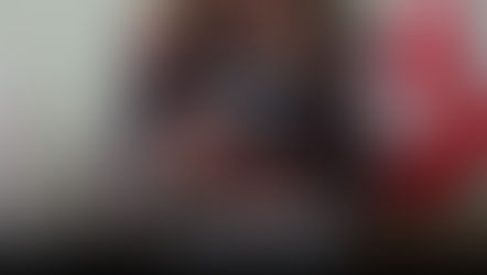 A Canadian government officer handing a Canadian citizen their Canadian passport back.