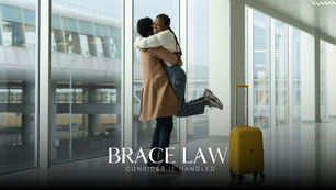 Husband welcoming home his wife at the airport with a big hug.