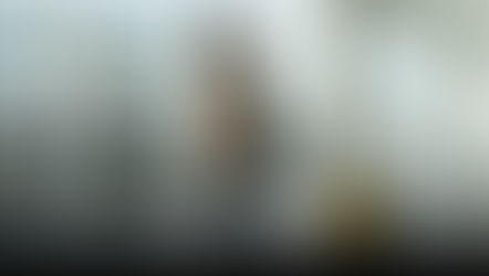 Husband welcoming home his wife at the airport with a big hug.