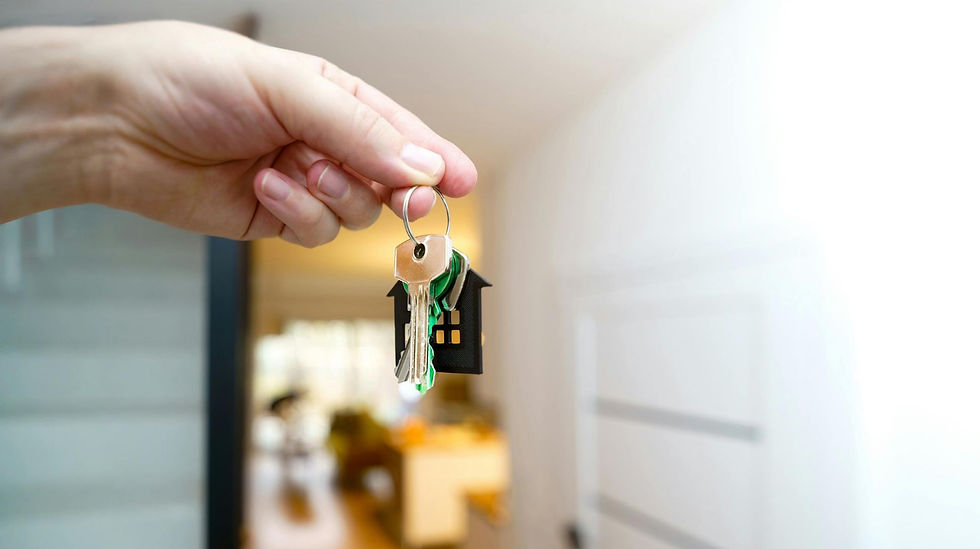Real estate lawyer handing over the house keys to the new owners.