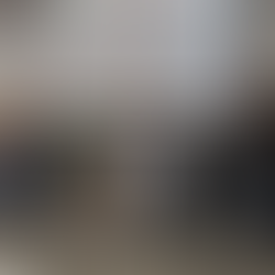 (Left) Freya Shaw from Immersion Sound Studio and (Right) John Thornewill from Red Nought give a presentation about a no-code game development tool. The slide behind them reads: “You bring the story. Simply plug together our easy-to-configure games engine ‘bricks’ to build new and original games. No coding required.”