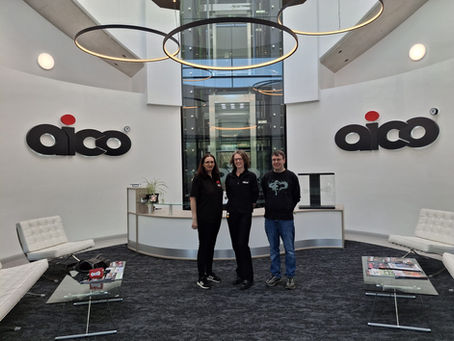 Picture of the Virtual Guide Dogs team in Aico reception with Becci Cumblidge