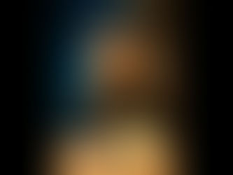 A clay-style character with short brown hair and glasses sits at a wooden desk, looking down at a small breadboard filled with wires and components. Two LEDs are lit on the board — one red and one yellow. The character looks slightly unsure or cautious, as if they’re not convinced the circuit will behave. Behind them, faint blue holographic code and diagrams float in the air, hinting at technology and problem-solving.