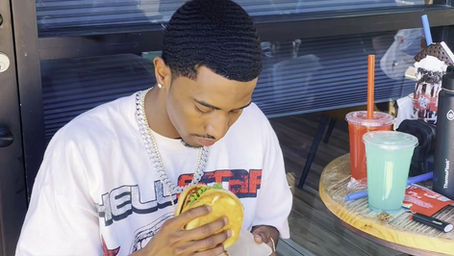 Diddy's son Christian Combs enjoys a delicious burger and shake at LOL Burger Bar.