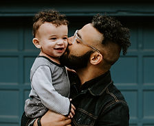 Father holding his baby boy with matching haircut_edited.jpg