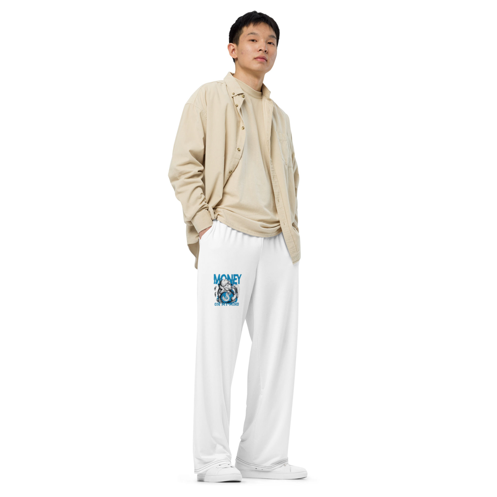 Model wearing beige jacket and white sweatpants
