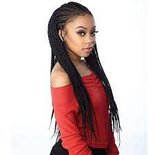 Thumbnail: Young woman with long braided hair and red top. Portrait shot.