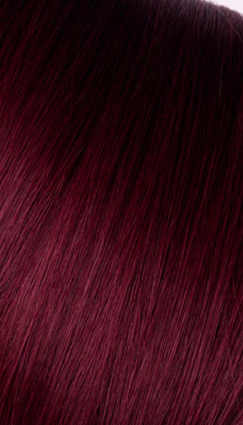 サムネイル： Close-up of vibrant burgundy hair, a striking color, showing natural texture.