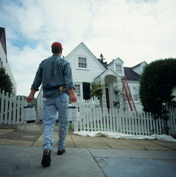 Contractor walking toward a new roof installation site for Tru-Pro Construction in Martinsville, IL