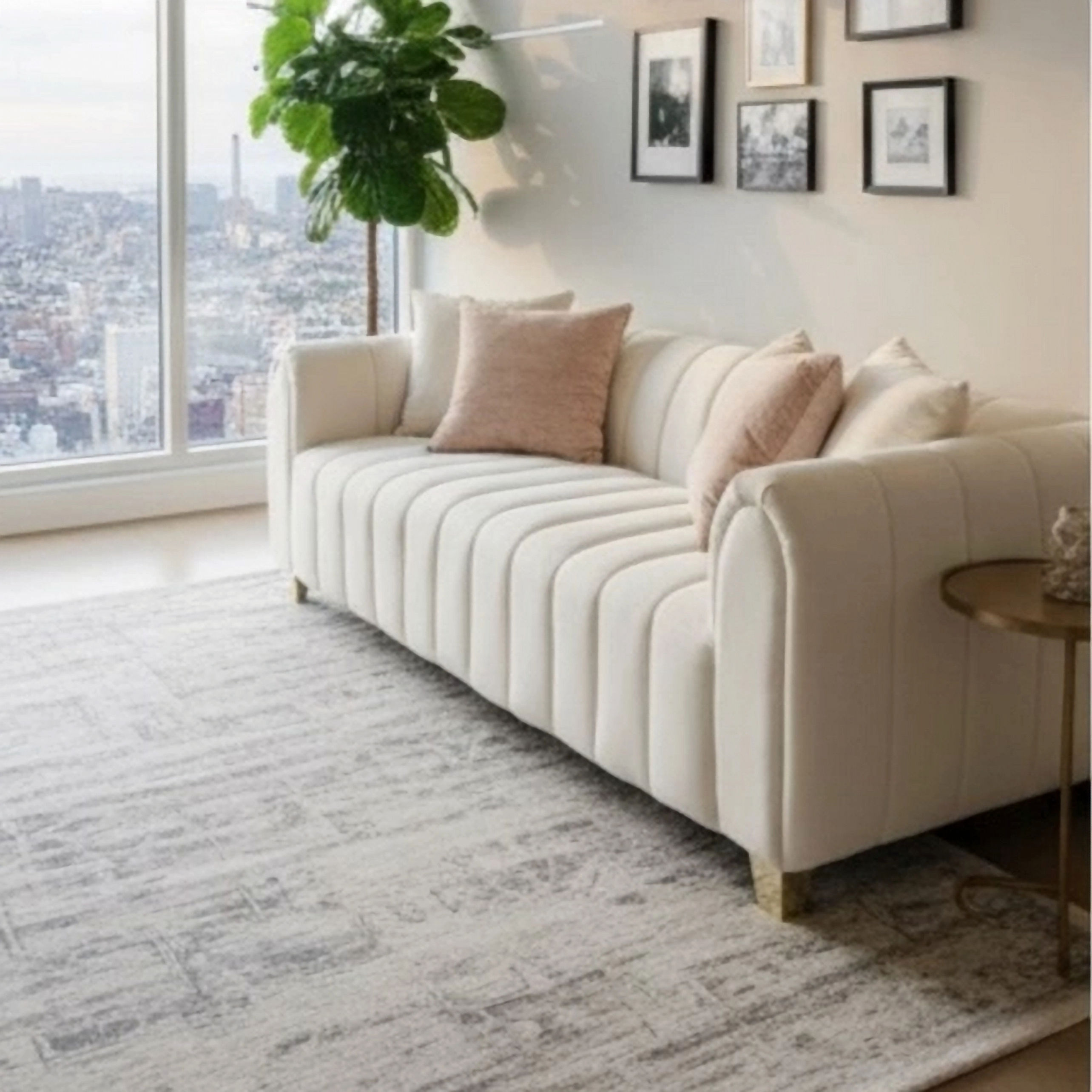 CloudSofa with plush tufted cushions in a bright modern living room