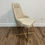 Thumbnail: beige tufted dining chair with gold legs