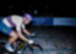 Professional Cyclist races through London at night
