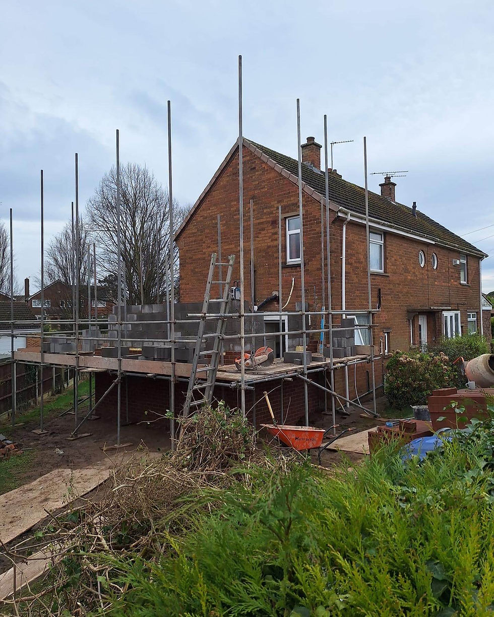 Ongoing property refurbishment with a two-storey extension, modern kitchen, and ensuite master bedroom by BMJ Property