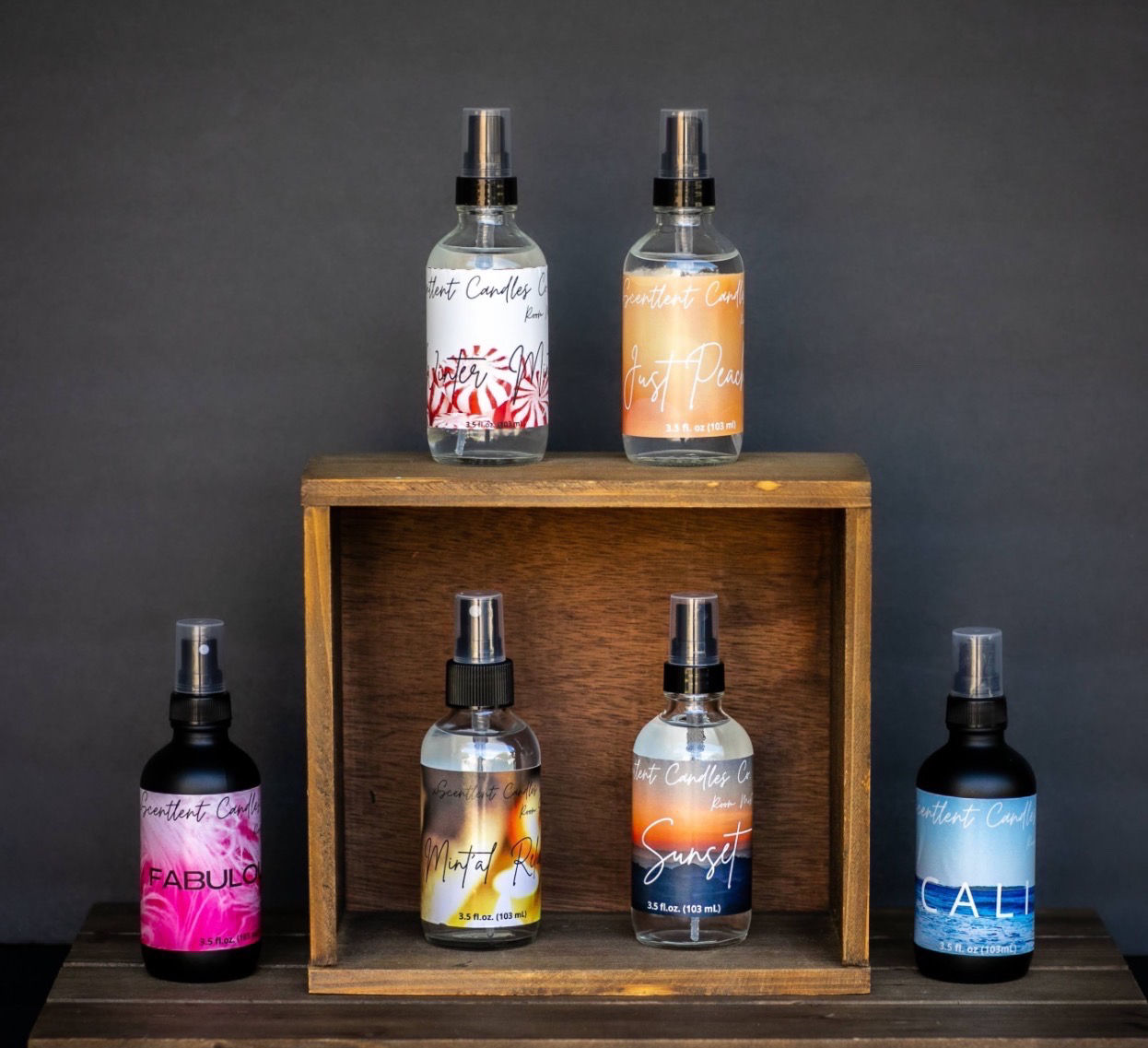Collection of various room mists in spray bottles.