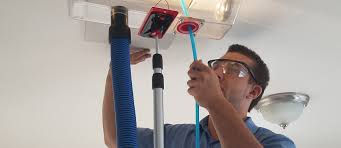 man cleaning the air vent