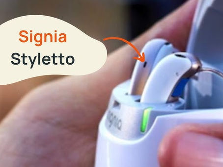 • The image features the Signia Styletto IX hearing aid and its charging case