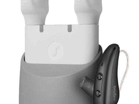 The image displays a Signia Orion Charge&Go hearing aid and its charging case.Â