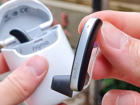 The image displays the Signia Styletto IX hearing aids, featuring RealTime Conversation Enhancement technology designed to help users stay connected with conversations.