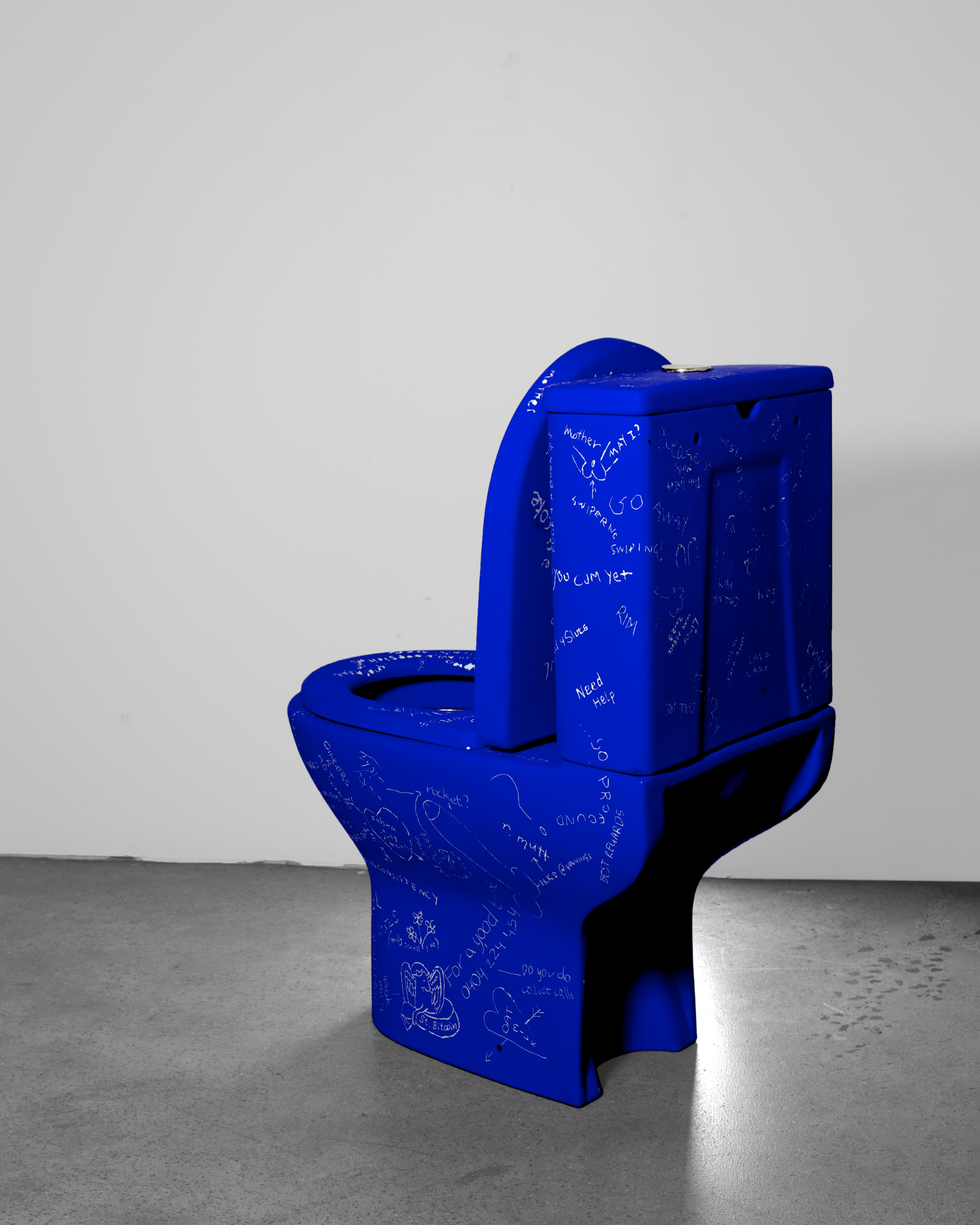 Side and rear view of Venus Alchemica by Mishele, showing blue-painted porcelain covered with scratched inscriptions.
