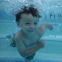 little boy swimming in pool