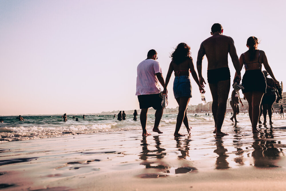 a blended family goes for a beach stroll