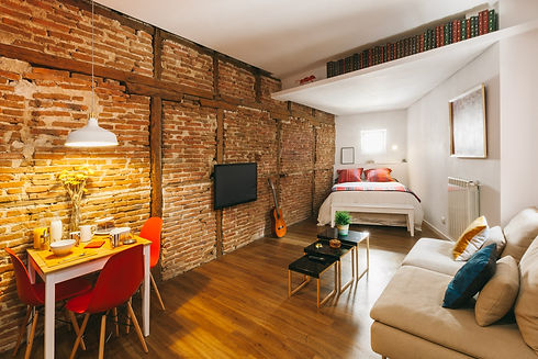 cozy-apartment-with-brick-walls-2023-11-27-05-29-43-utc-min.jpg