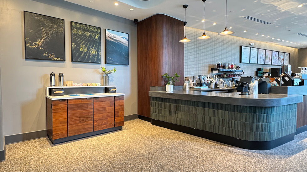 Starbucks barista counter with wood finishes and integrated lighting