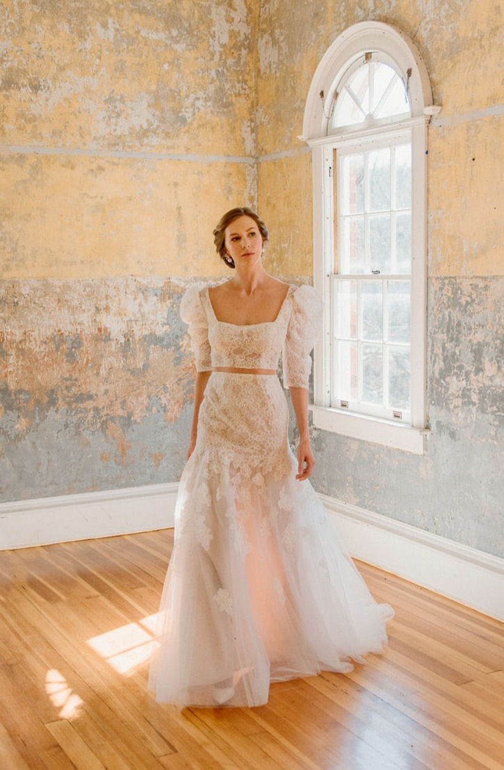 Thumbnail: Front view of a lace square neckline wedding dress with a drop waist and puff sleeves