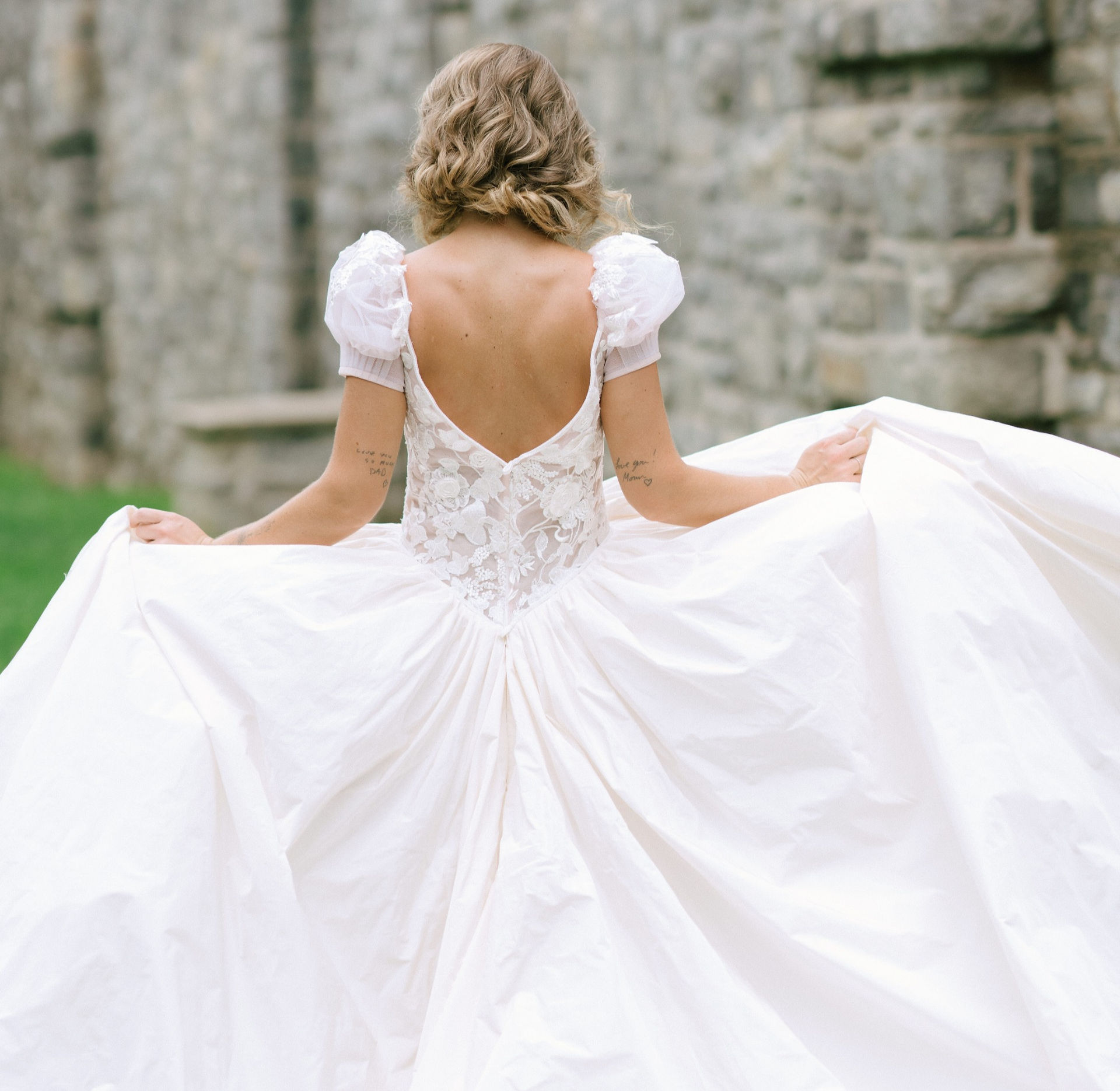 embroidered ballgown wedding dress with open back and puff sleeves