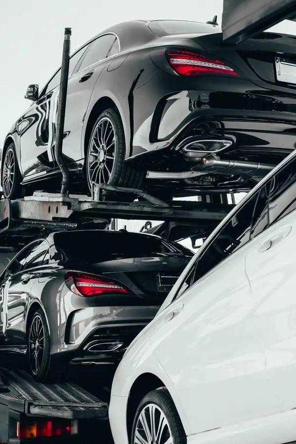 big-car-carrier-truck-new-luxury-sport-german-cars-batch-delivery-to-dealership-full-load-