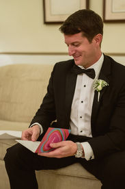 groom at hotel el convento reading a card