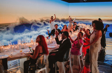 guests singing and clapping the couple