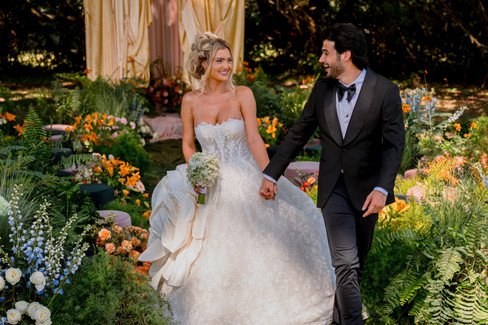 Bride wearing a grand Esé Azénabor, featuring a spectacular, oversized sculptural flower,” Jafet explains, “while the groom swapped his colorful look for a classic black jacket for a more timeless, sophisticated feel
