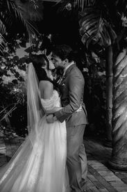 bride and groom sharing their first kiss at the altar in hacienda siesta alegre