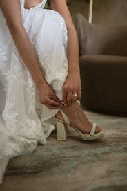 bride putting her shoe